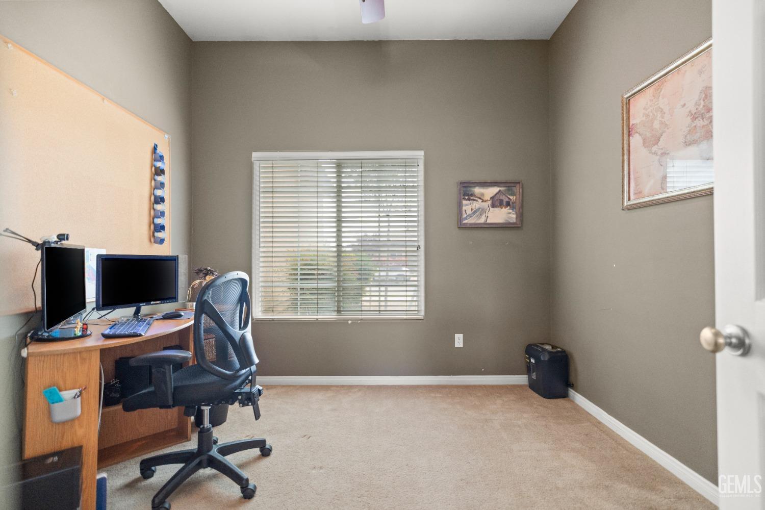 Undisclosed Address Bakersfield, CA 93306 - Photo 25 of 42 a view of a workspace with furniture and a window