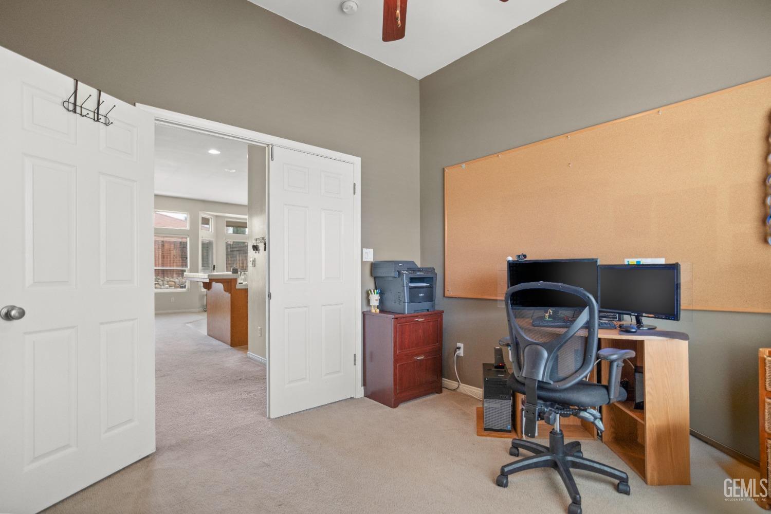 Undisclosed Address Bakersfield, CA 93306 - Photo 26 of 42 a view of a workspace with furniture and a window