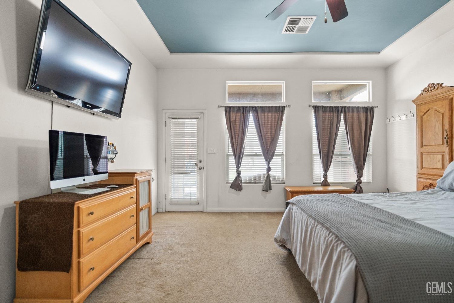 Undisclosed Address Bakersfield, CA 93306 - Photo 28 of 42 a bedroom with furniture and flat screen tv