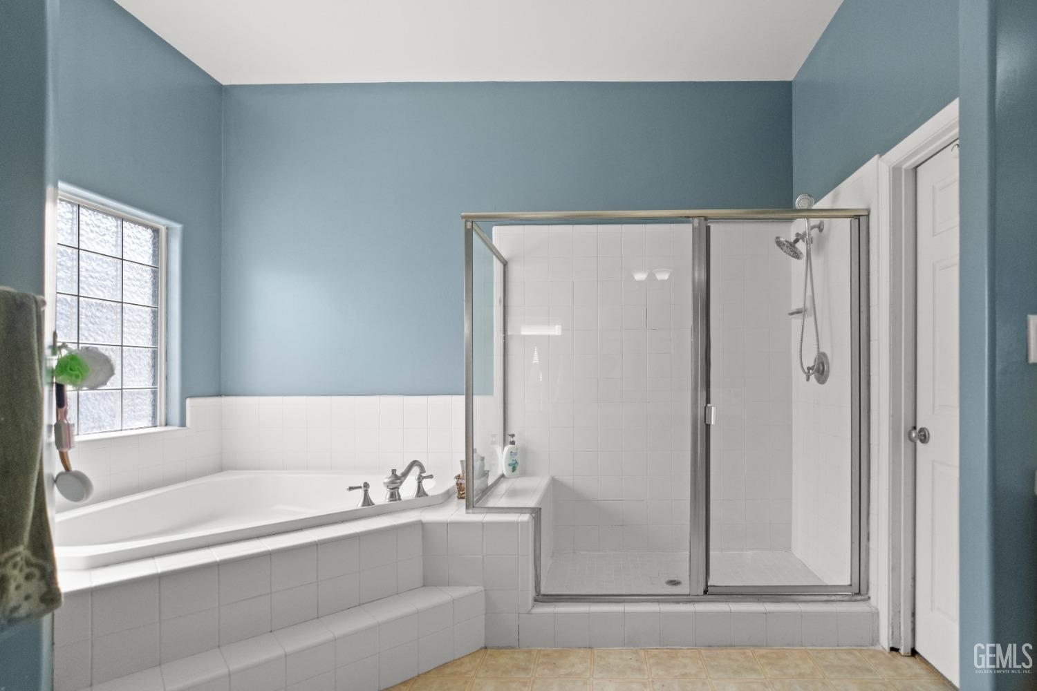 Undisclosed Address Bakersfield, CA 93306 - Photo 31 of 42 a bathroom with a bathtub and a shower