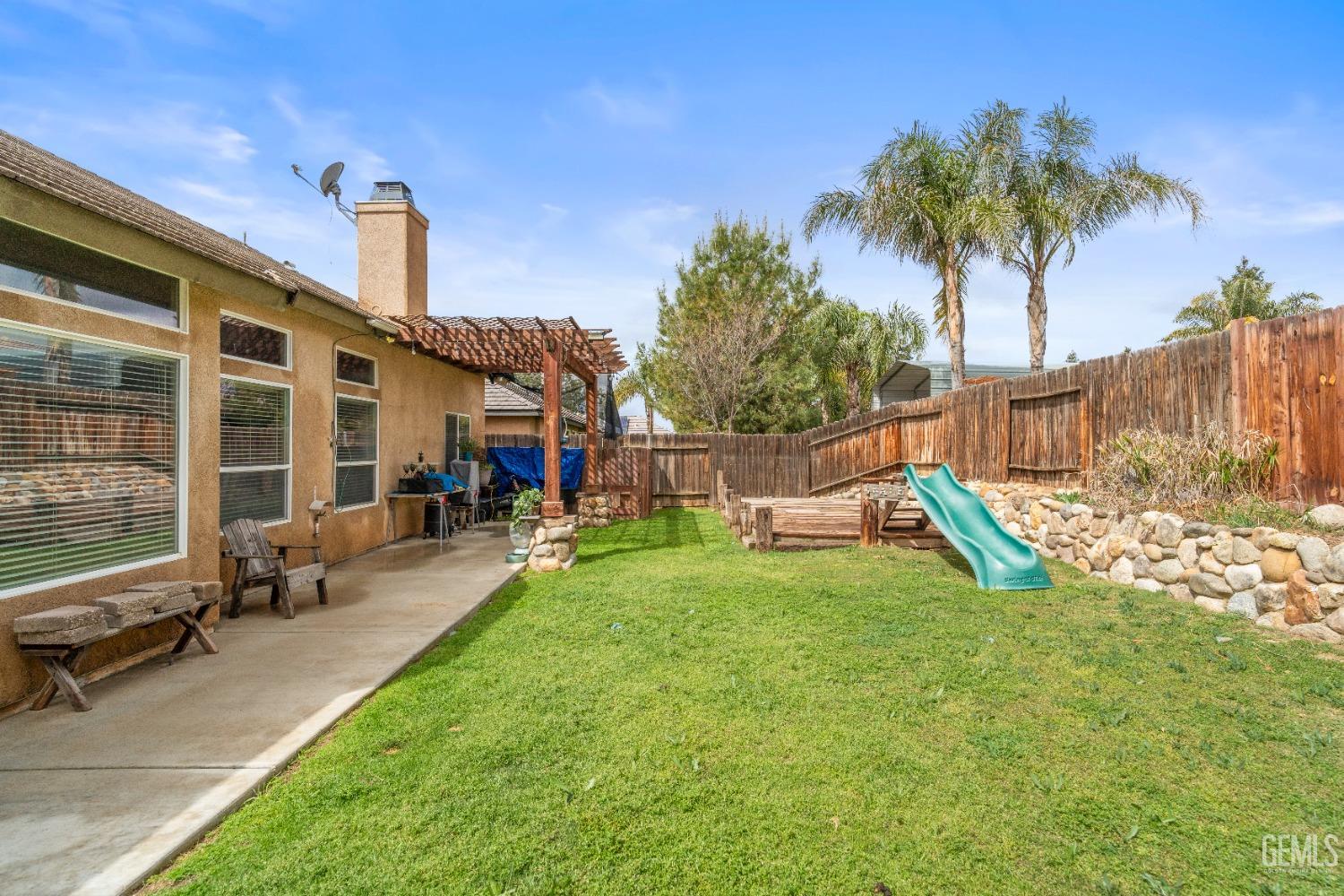 Undisclosed Address Bakersfield, CA 93306 - Photo 36 of 42 a view of a house with backyard porch and sitting area