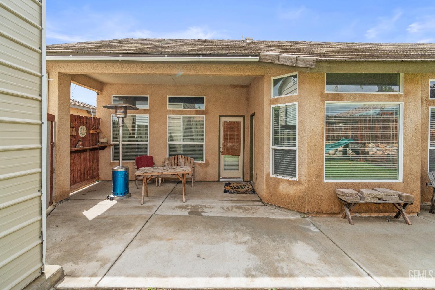 Undisclosed Address Bakersfield, CA 93306 - Photo 37 of 42 a view of a patio with a dining table and chairs