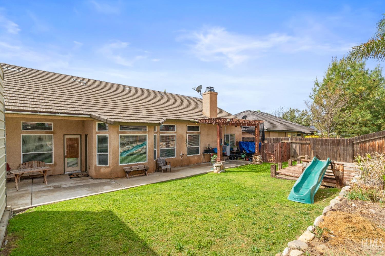 Undisclosed Address Bakersfield, CA 93306 - Photo 38 of 42 a view of a house with a yard patio and swimming pool