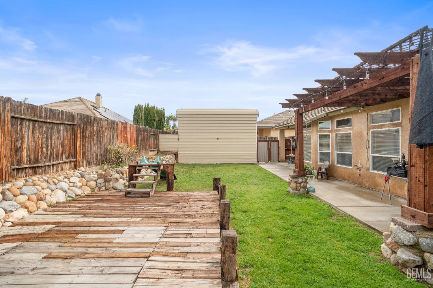 Undisclosed Address Bakersfield, CA 93306 - Photo 40 of 42 a view of a house with backyard porch and sitting area