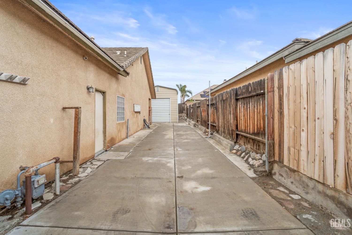 Undisclosed Address Bakersfield, CA 93306 - Photo 42 of 42 a view of a house with a backyard