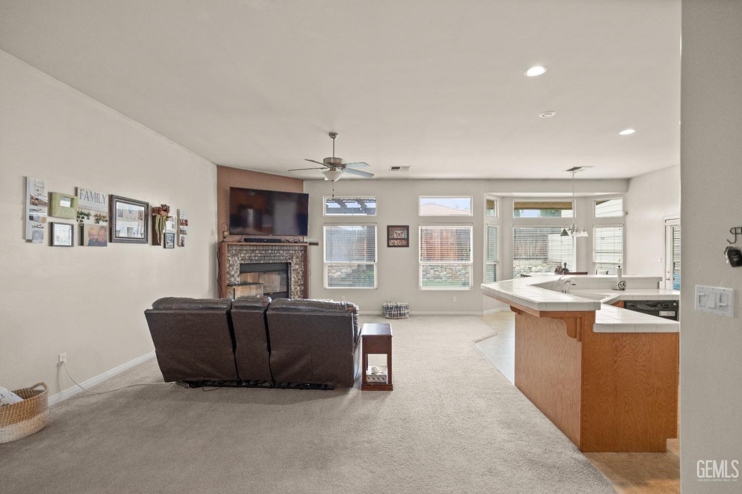 Undisclosed Address Bakersfield, CA 93306 - Photo 7 of 42 a living room with fireplace furniture and a flat screen tv