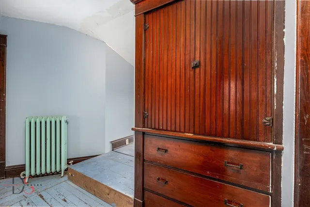 an empty room with wooden floor