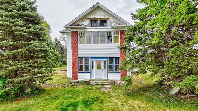 front view of a house with a yard