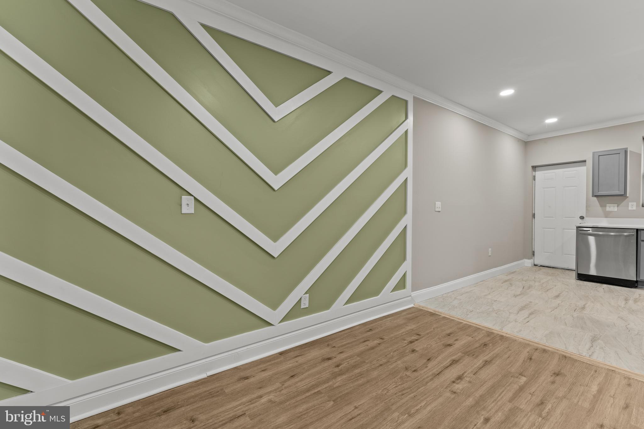 2560 Robb Street Baltimore, MD 21218 - Photo 13 of 19 a view of an empty room with wooden floor and a window