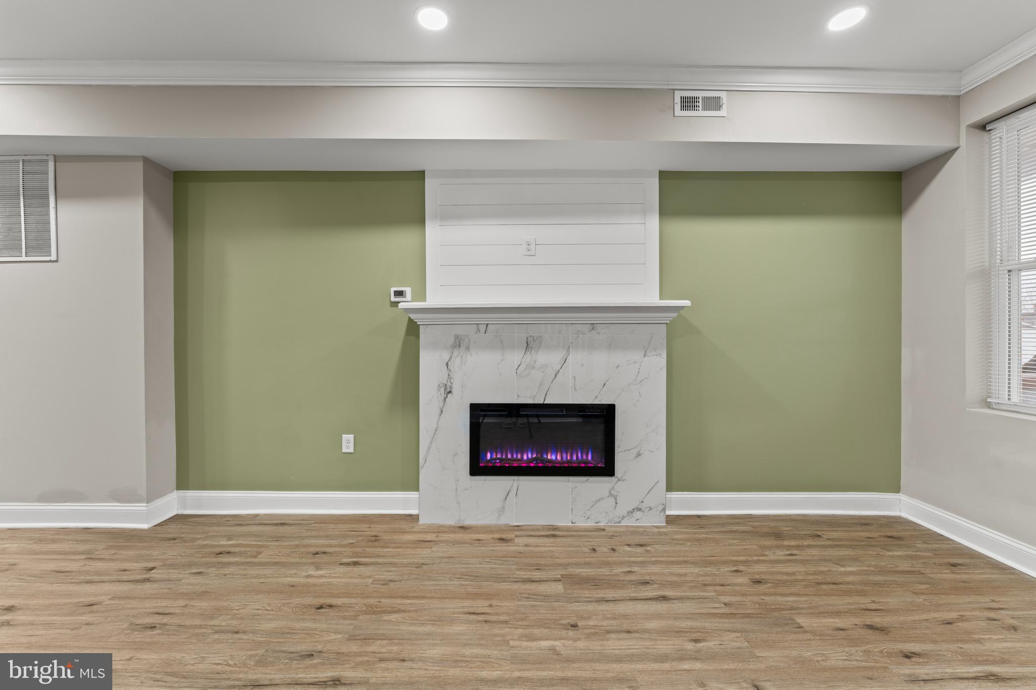 2560 Robb Street Baltimore, MD 21218 - Photo 4 of 19 a living room with a fireplace