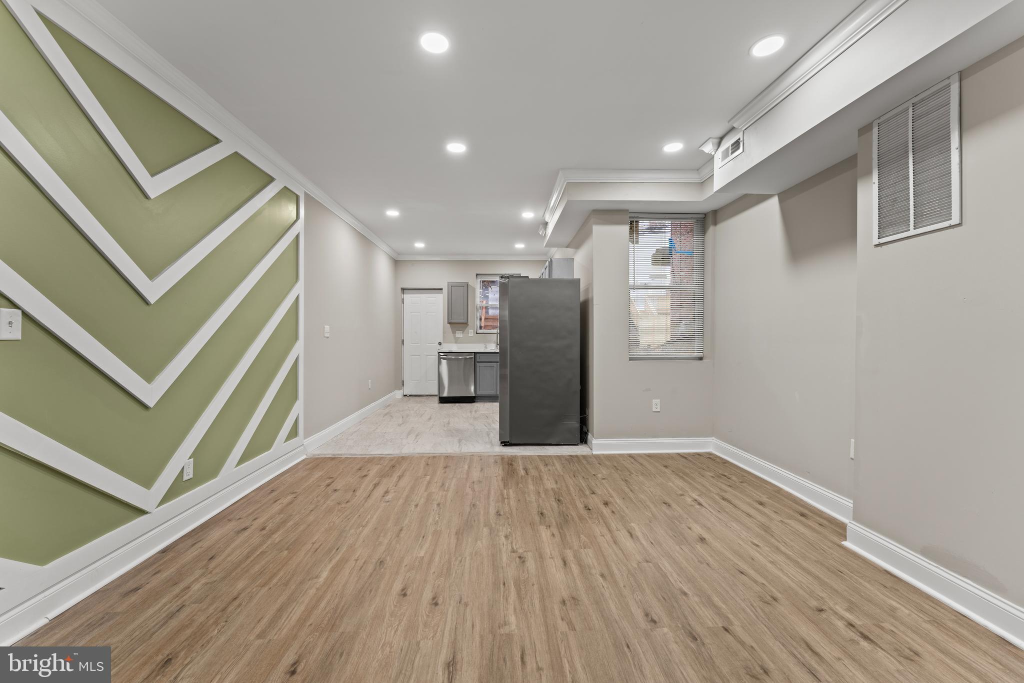 2560 Robb Street Baltimore, MD 21218 - Photo 5 of 19 a view of empty room with wooden floor