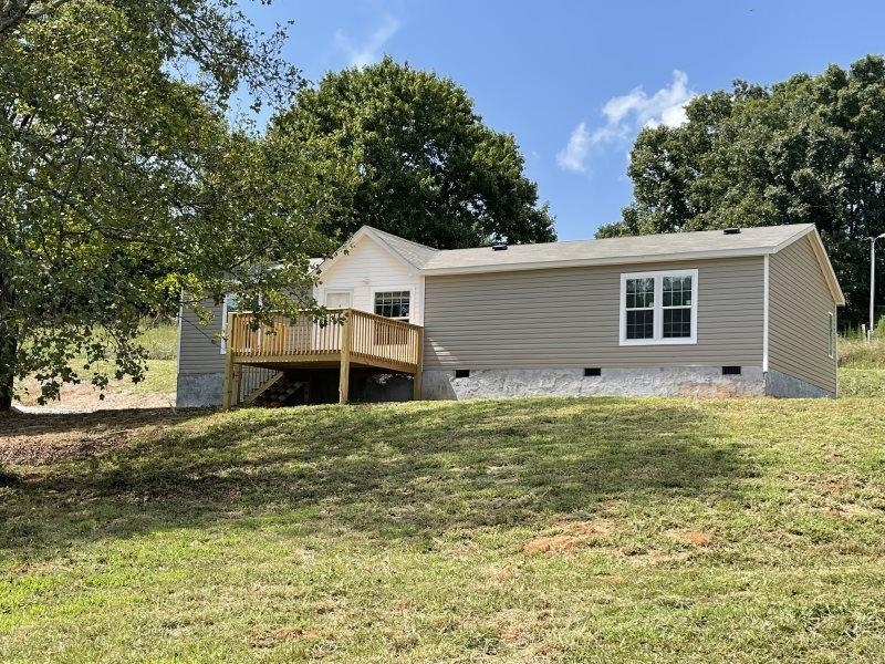1475 May White Road Cleveland, GA 30528 - Photo 1 of 1 a house that has a tree in front of it