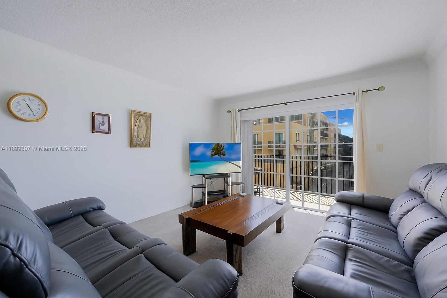 8900 Collins Avenue, Unit 301 Surfside, FL 33154 - Photo 17 of 35 a living room with furniture and a window