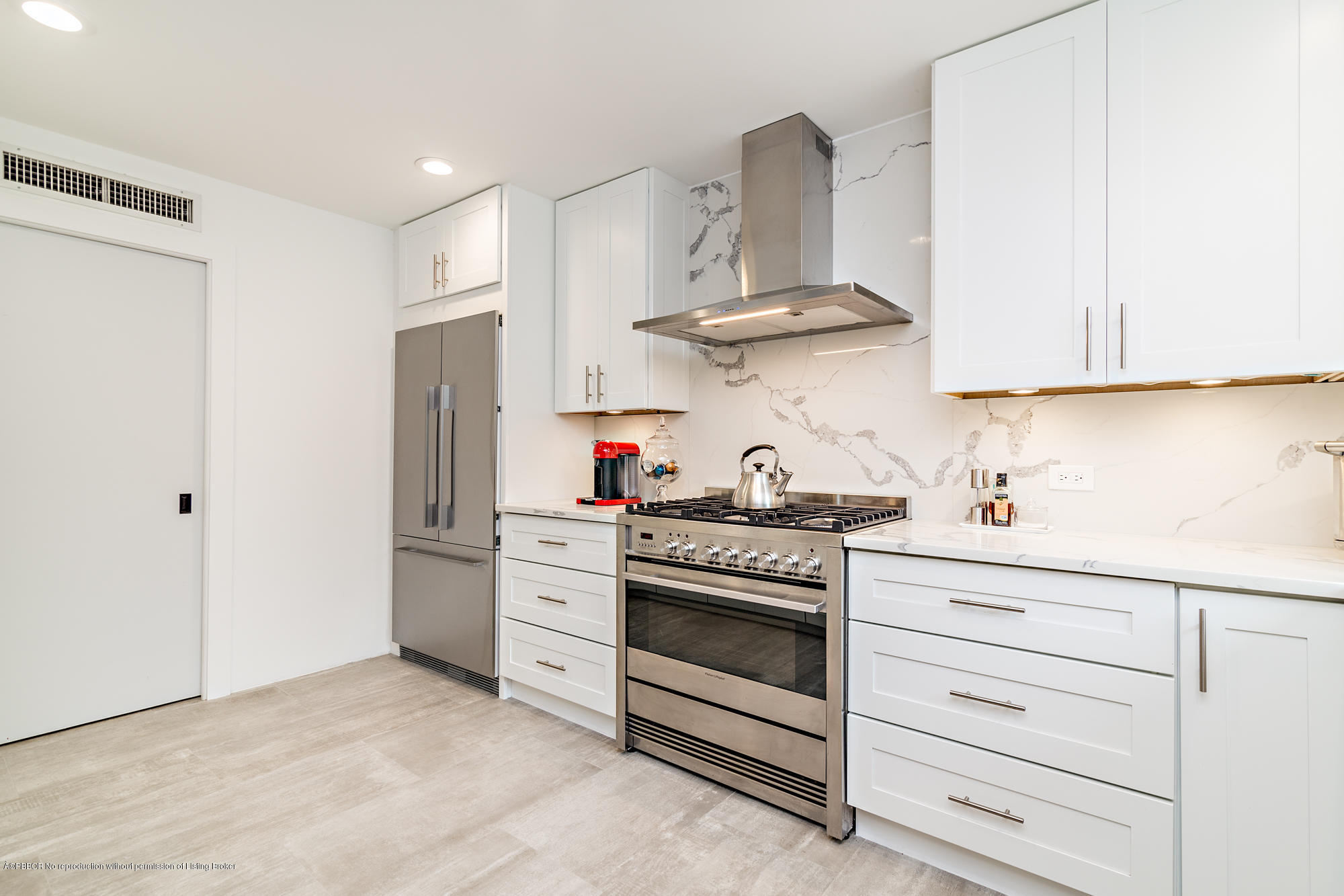321 Churchill Road West Palm Beach, FL 33405 - Photo 12 of 44 a kitchen with white cabinets and white appliances