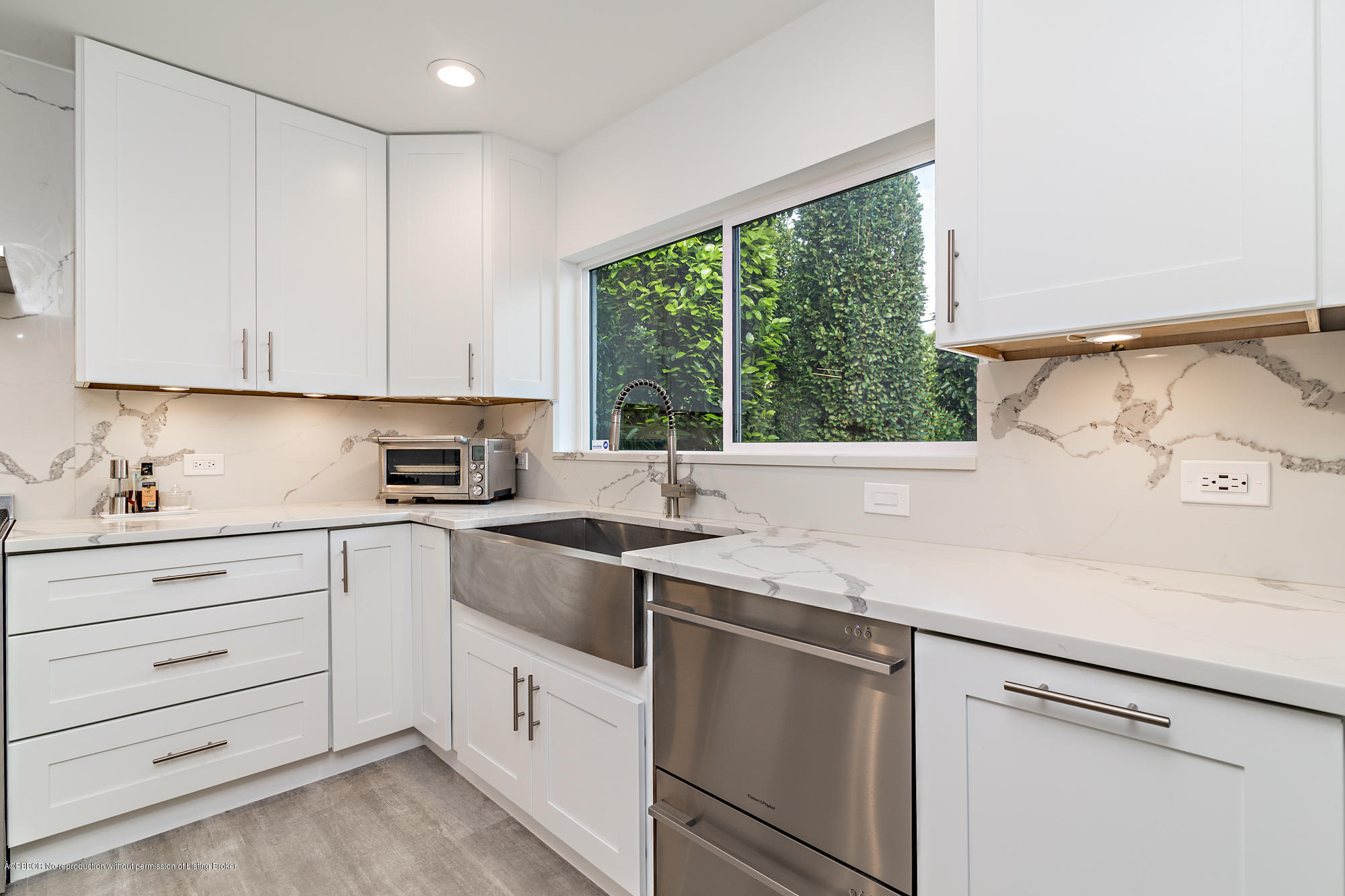 321 Churchill Road West Palm Beach, FL 33405 - Photo 13 of 44 a kitchen with stainless steel appliances white cabinets and a window