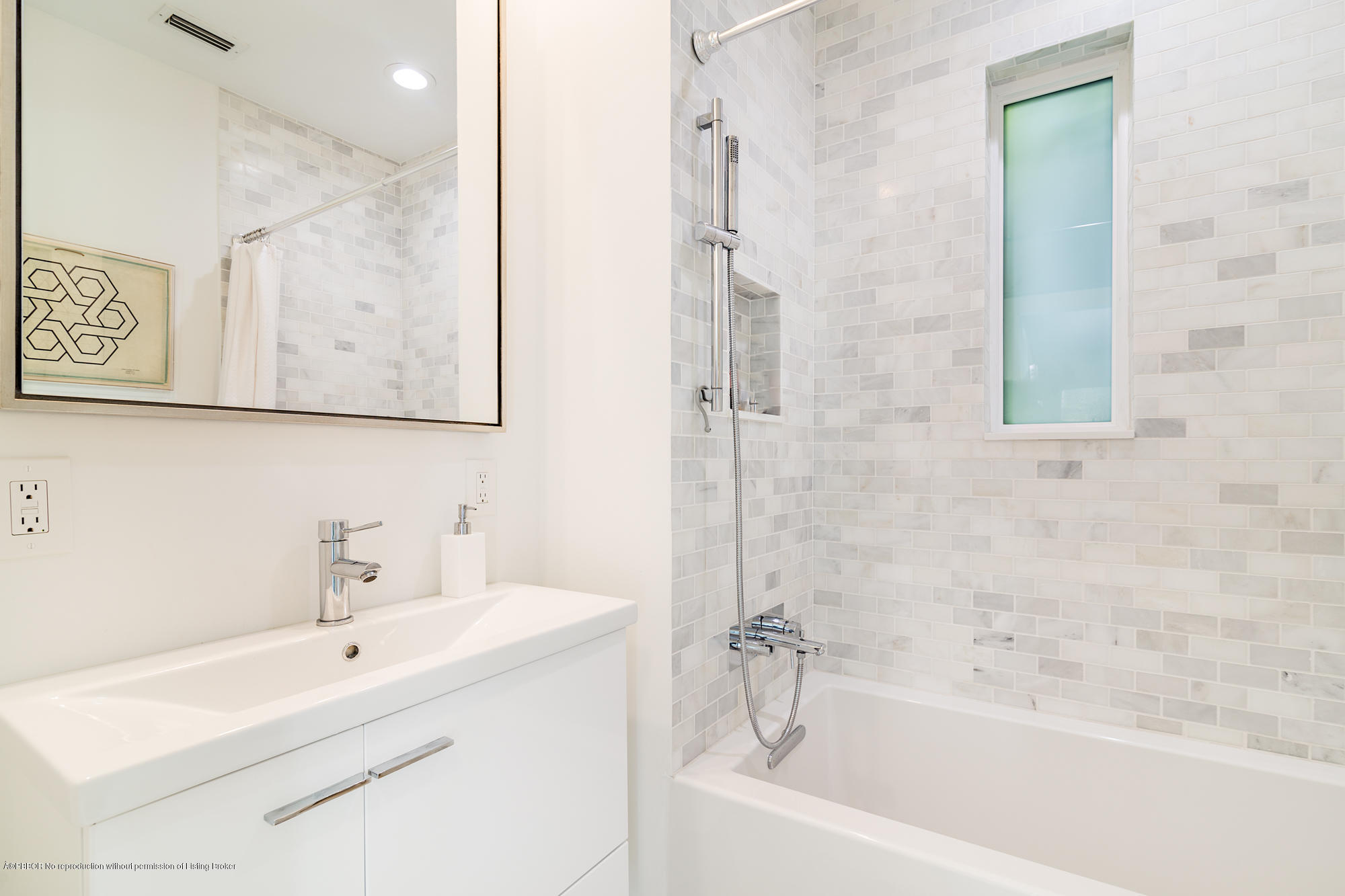 321 Churchill Road West Palm Beach, FL 33405 - Photo 18 of 44 a bathroom with a bathtub a sink and a window