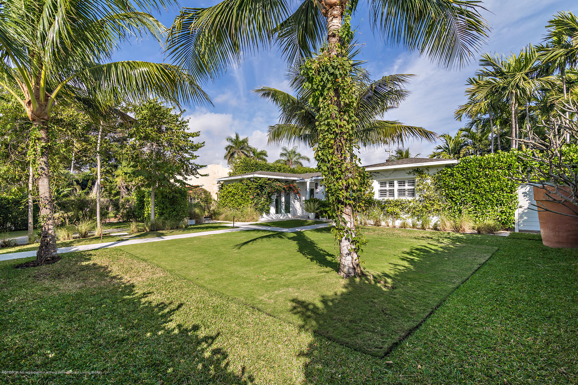 321 Churchill Road West Palm Beach, FL 33405 - Photo 20 of 44 a view of a swimming pool with a garden