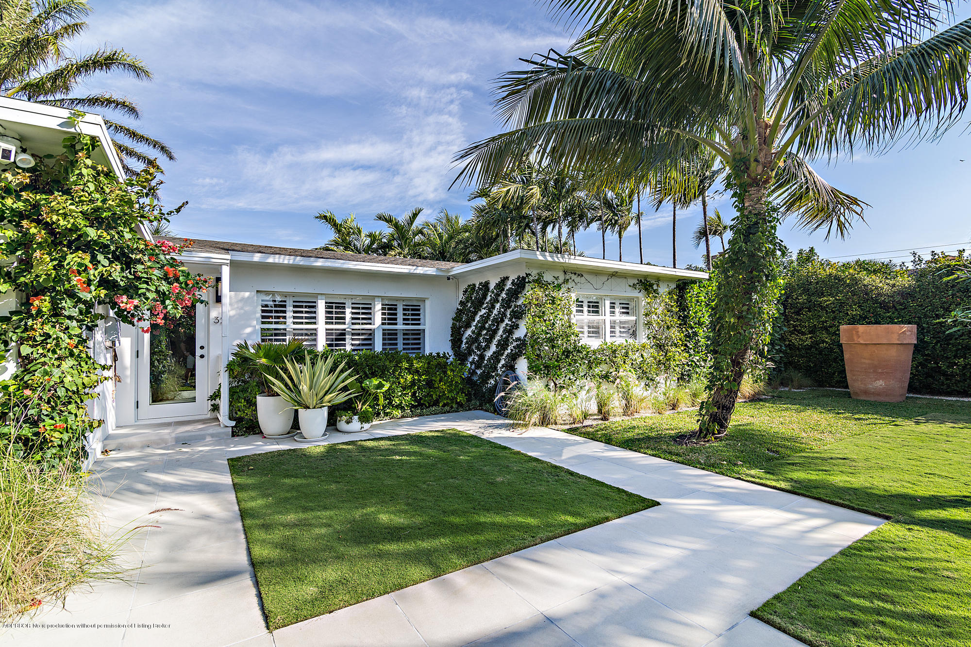 321 Churchill Road West Palm Beach, FL 33405 - Photo 22 of 44 a front view of house and yard with green space