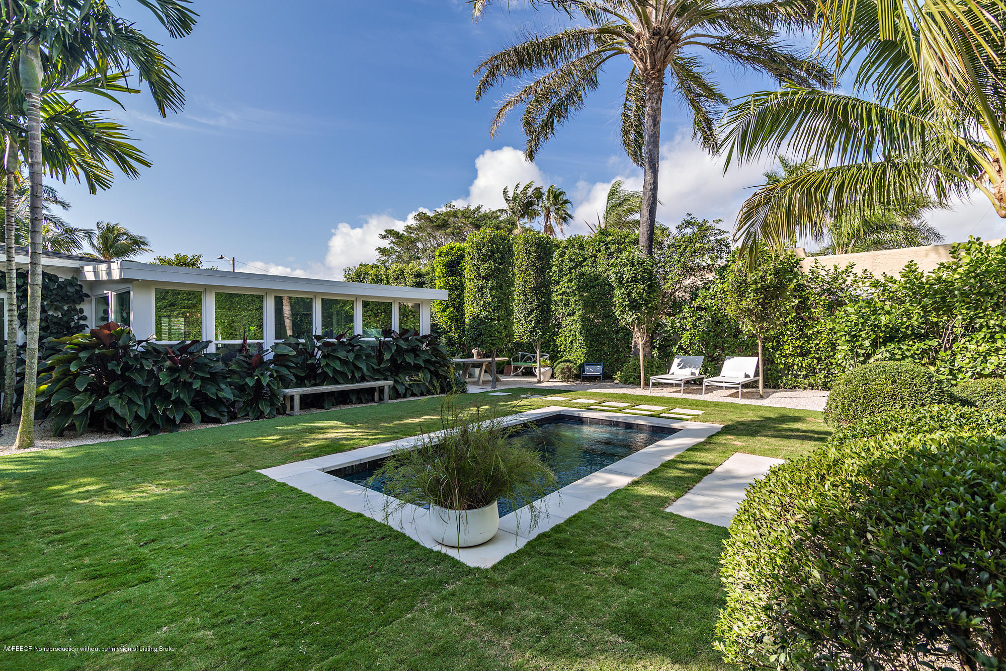 321 Churchill Road West Palm Beach, FL 33405 - Photo 28 of 44 a view of a house with swimming pool and a chairs