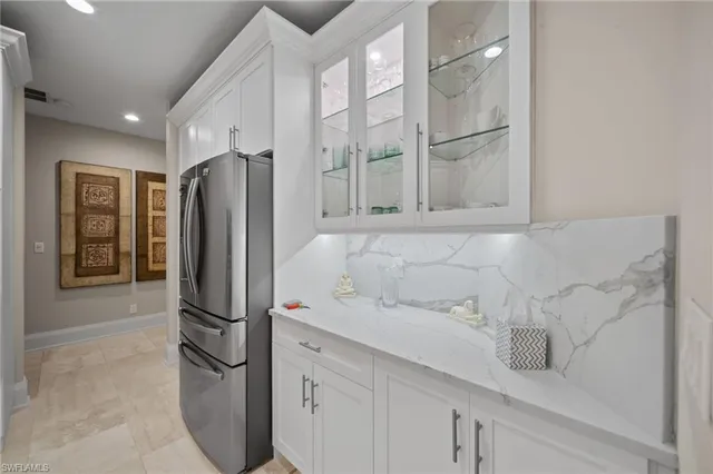 a kitchen with stainless steel appliances refrigerator and cabinets