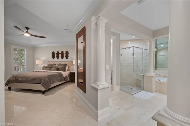 a spacious bedroom with a bed and a shower