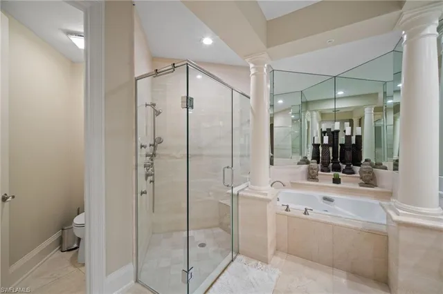 a bathroom with a shower sink and mirror