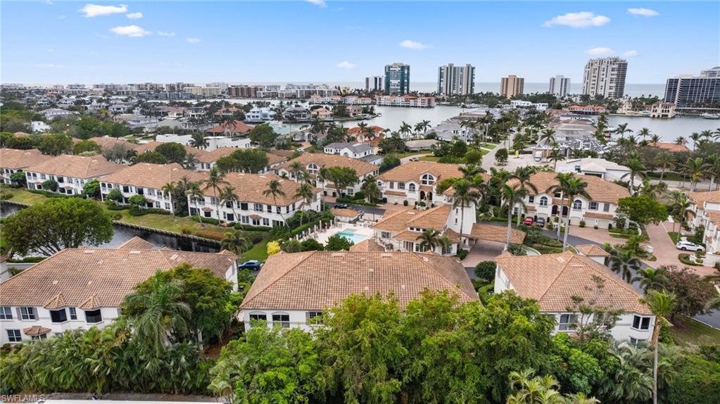 261 Colonade Circle, Unit 2701 Naples, FL 34103 - Photo 43 of 49 an aerial view of a city with lots of residential buildings