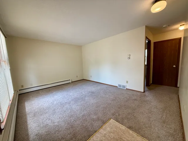 an empty room with a bench