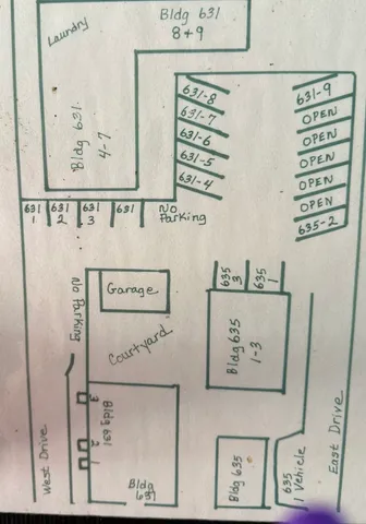 an aerial view of a house with a yard and trees
