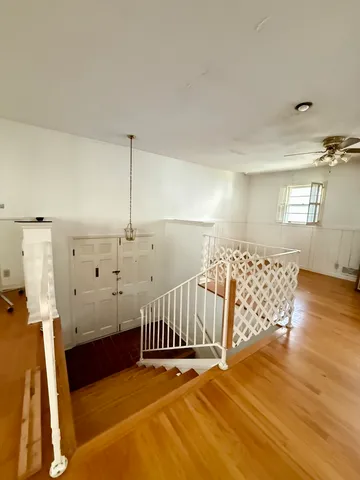 a view of a livingroom with wooden floor