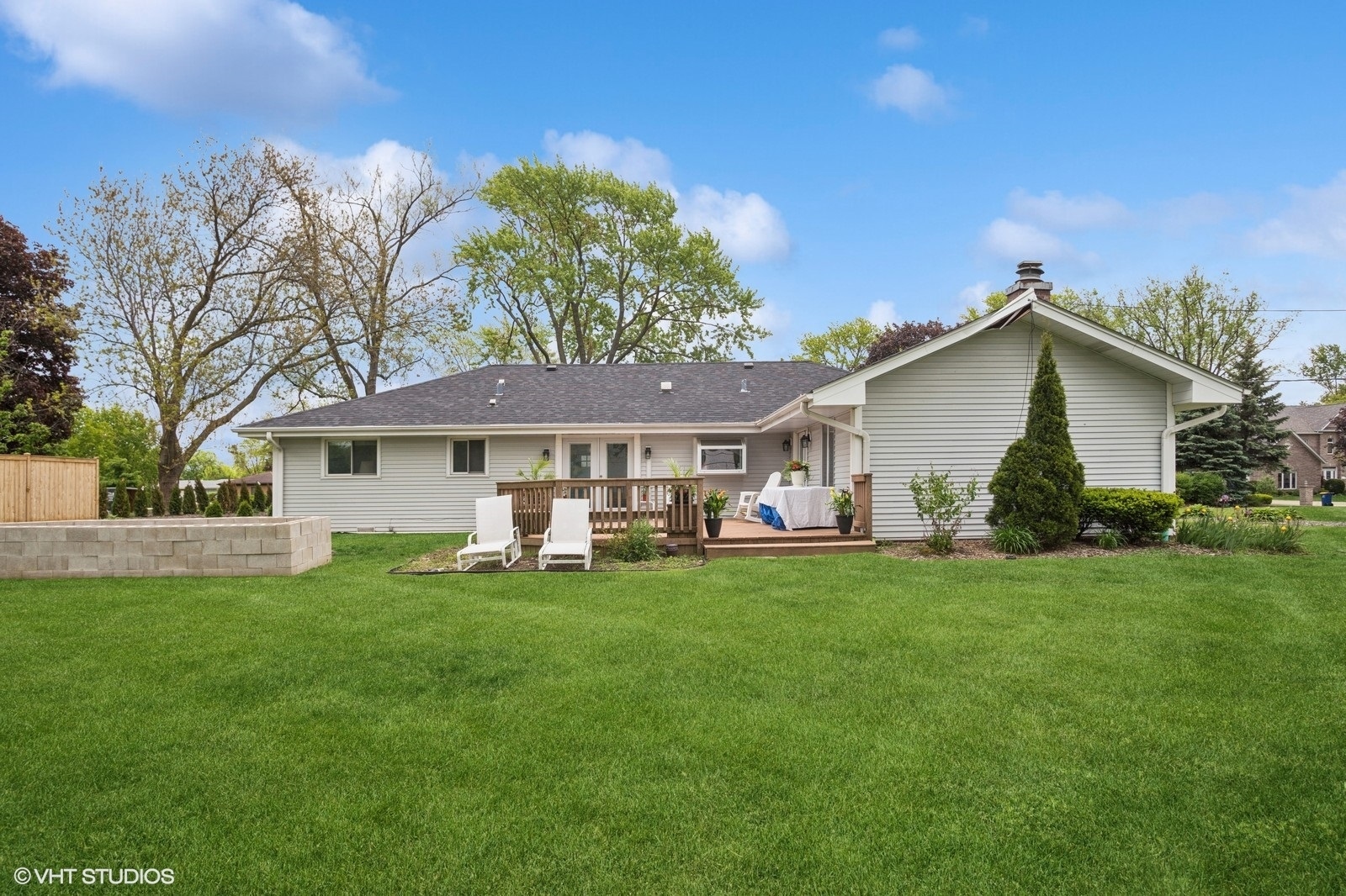 2050 Beechnut Road Northbrook, IL 60062 - Photo 16 of 18 a front view of a house with a garden and trees