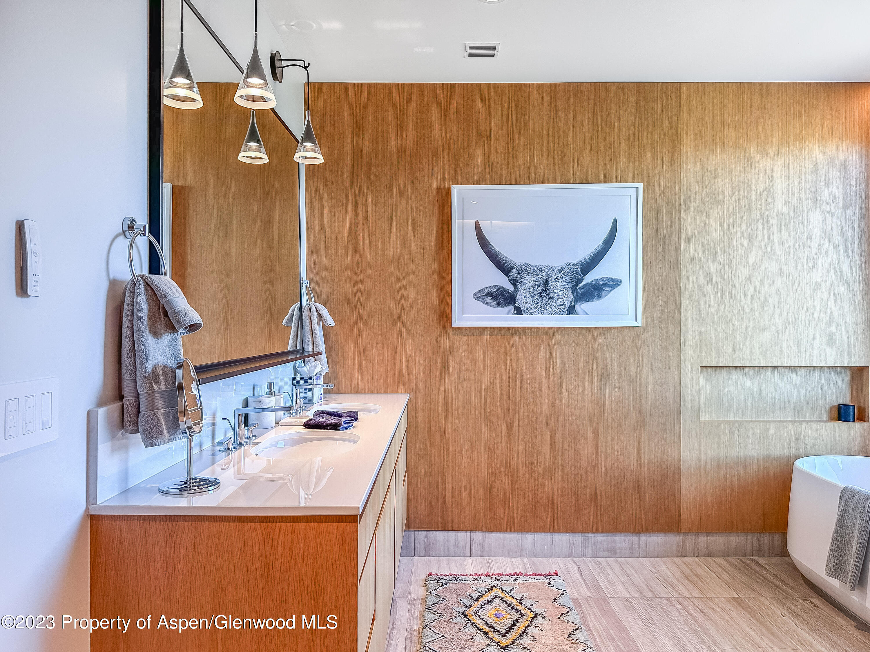 77 Wood Road, Unit 607E Snowmass Village, CO 81615 - Photo 13 of 29 a bathroom with a sink and a mirror