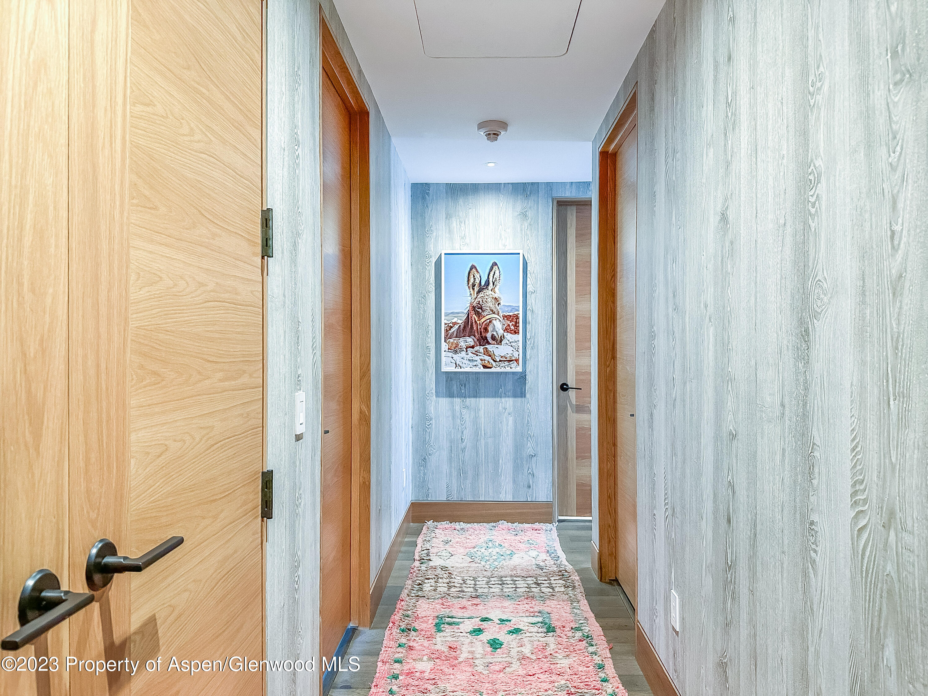 77 Wood Road, Unit 607E Snowmass Village, CO 81615 - Photo 22 of 29 a view of a hallway with wooden floor and closet