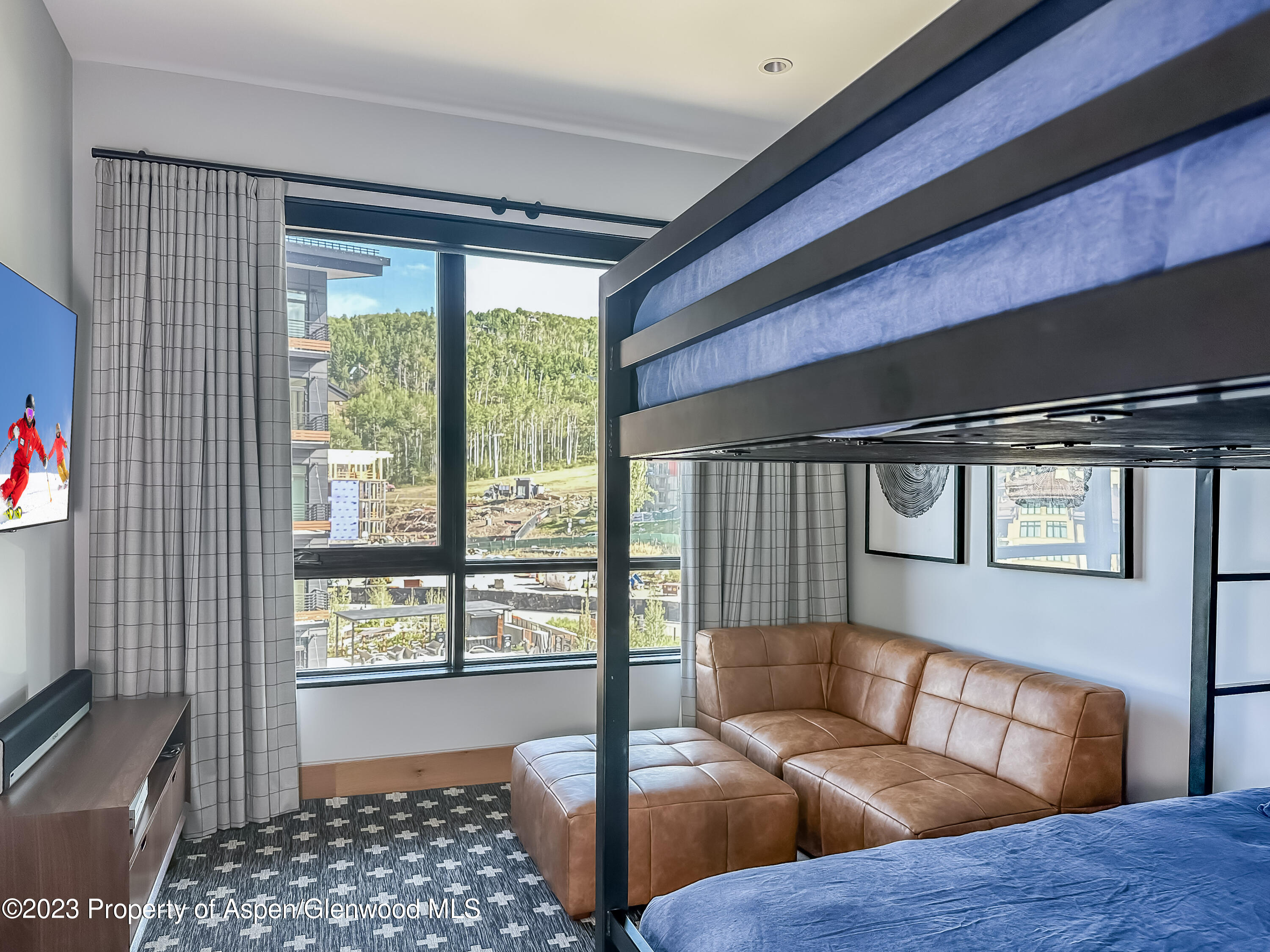 77 Wood Road, Unit 607E Snowmass Village, CO 81615 - Photo 24 of 29 a living room with furniture and a window