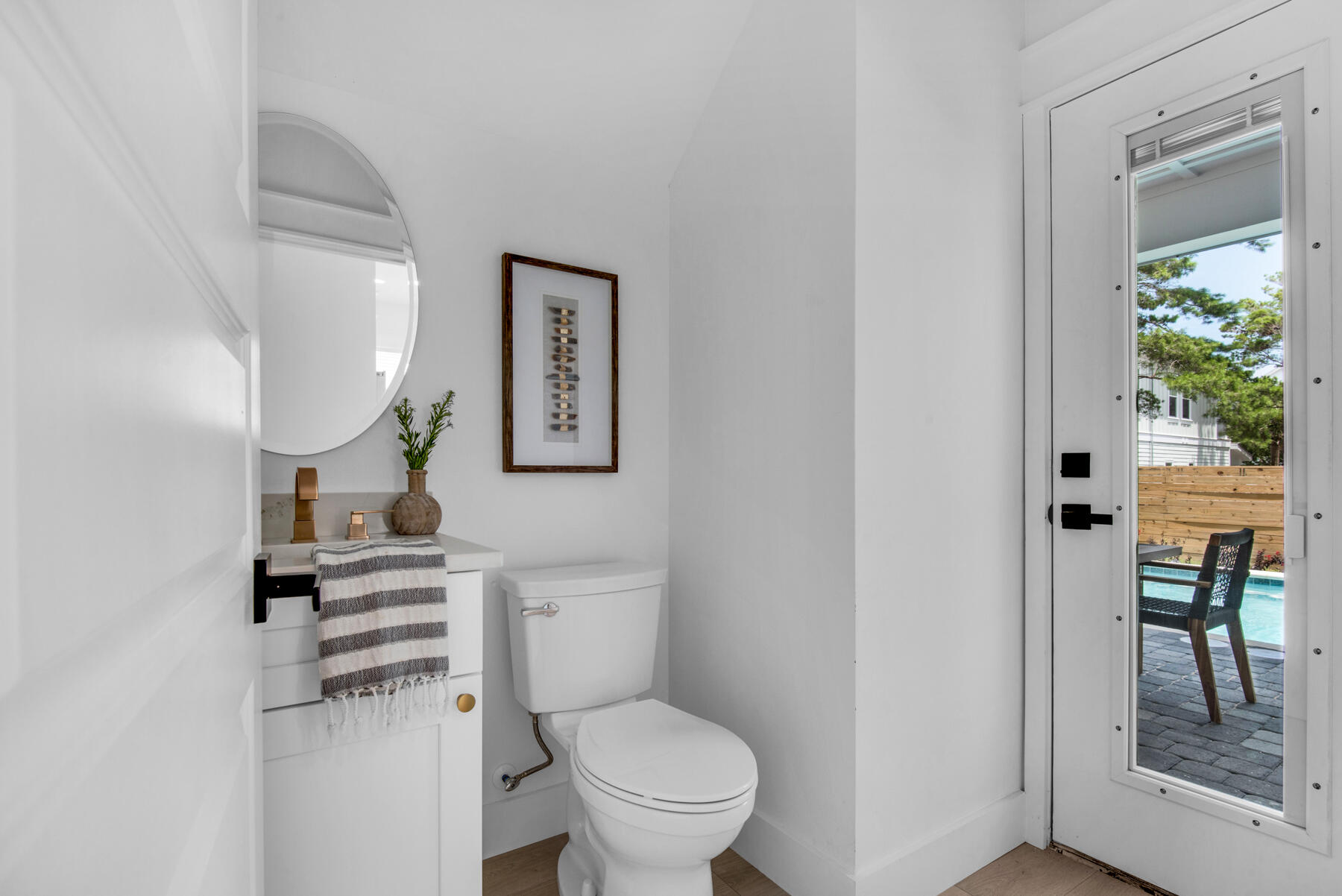 22 Ruth Street Miramar Beach, FL 32550 - Photo 22 of 66 a bathroom with a toilet a sink and a mirror