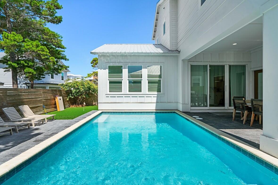 22 Ruth Street Miramar Beach, FL 32550 - Photo 3 of 66 a view of a house with backyard porch and sitting area