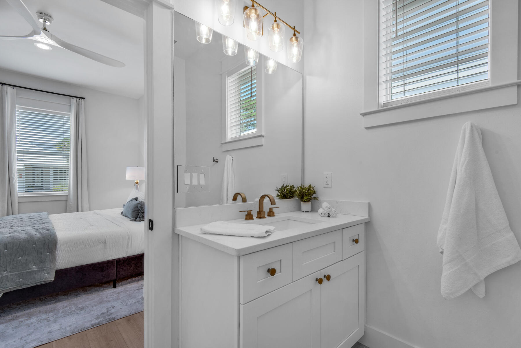 22 Ruth Street Miramar Beach, FL 32550 - Photo 33 of 66 a en suite bathroom with a sink and a mirror