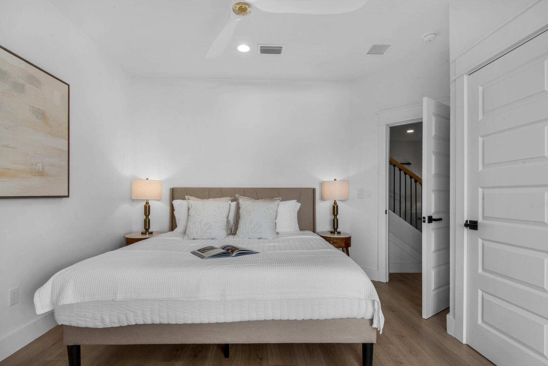 22 Ruth Street Miramar Beach, FL 32550 - Photo 36 of 66 a bedroom with a bed and wooden floor