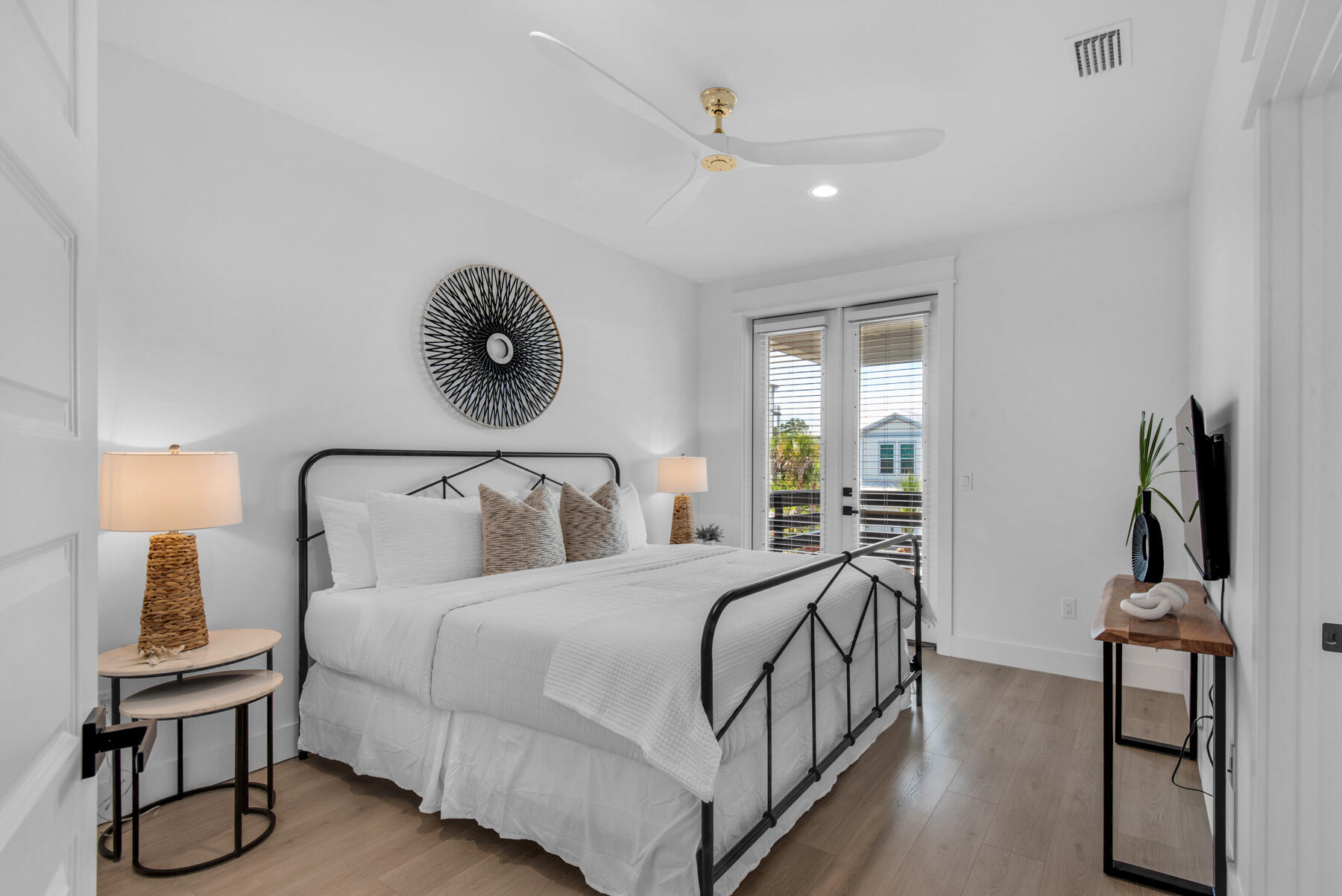 22 Ruth Street Miramar Beach, FL 32550 - Photo 43 of 66 a bedroom with a bed and wooden floor