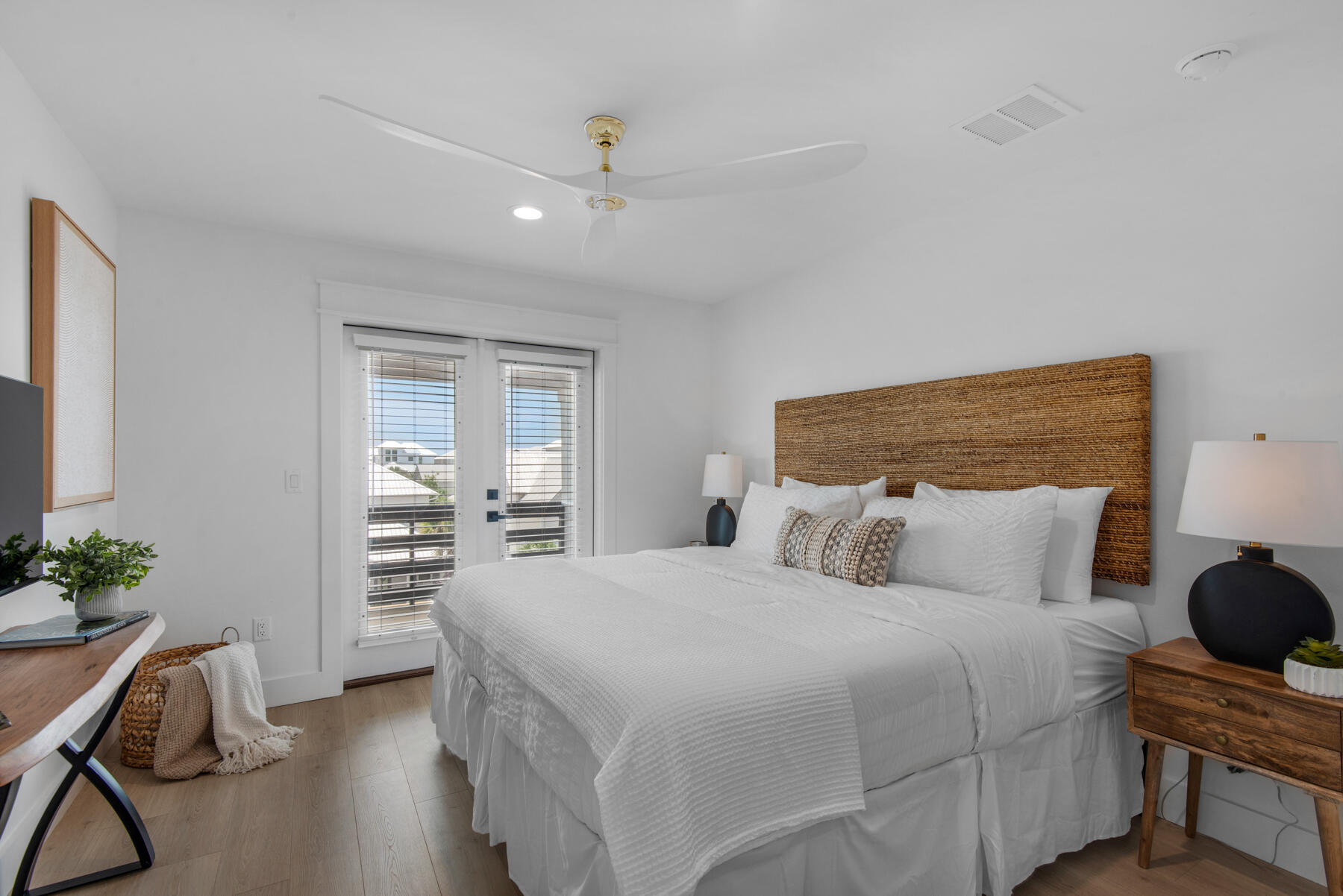 22 Ruth Street Miramar Beach, FL 32550 - Photo 59 of 66 a bedroom with a bed and a potted plant on the dresser