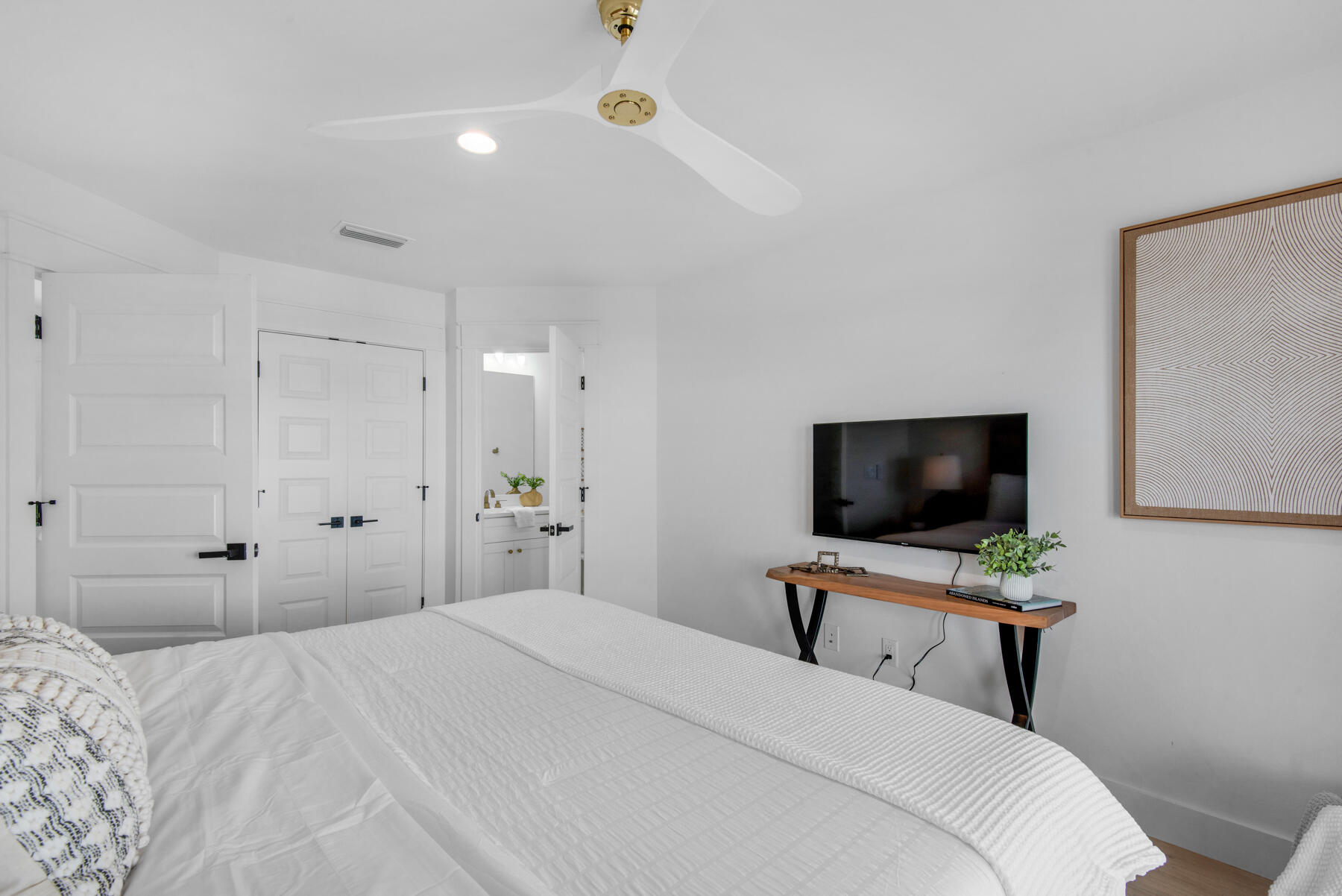 22 Ruth Street Miramar Beach, FL 32550 - Photo 60 of 66 a bedroom with a bed and a flat screen tv