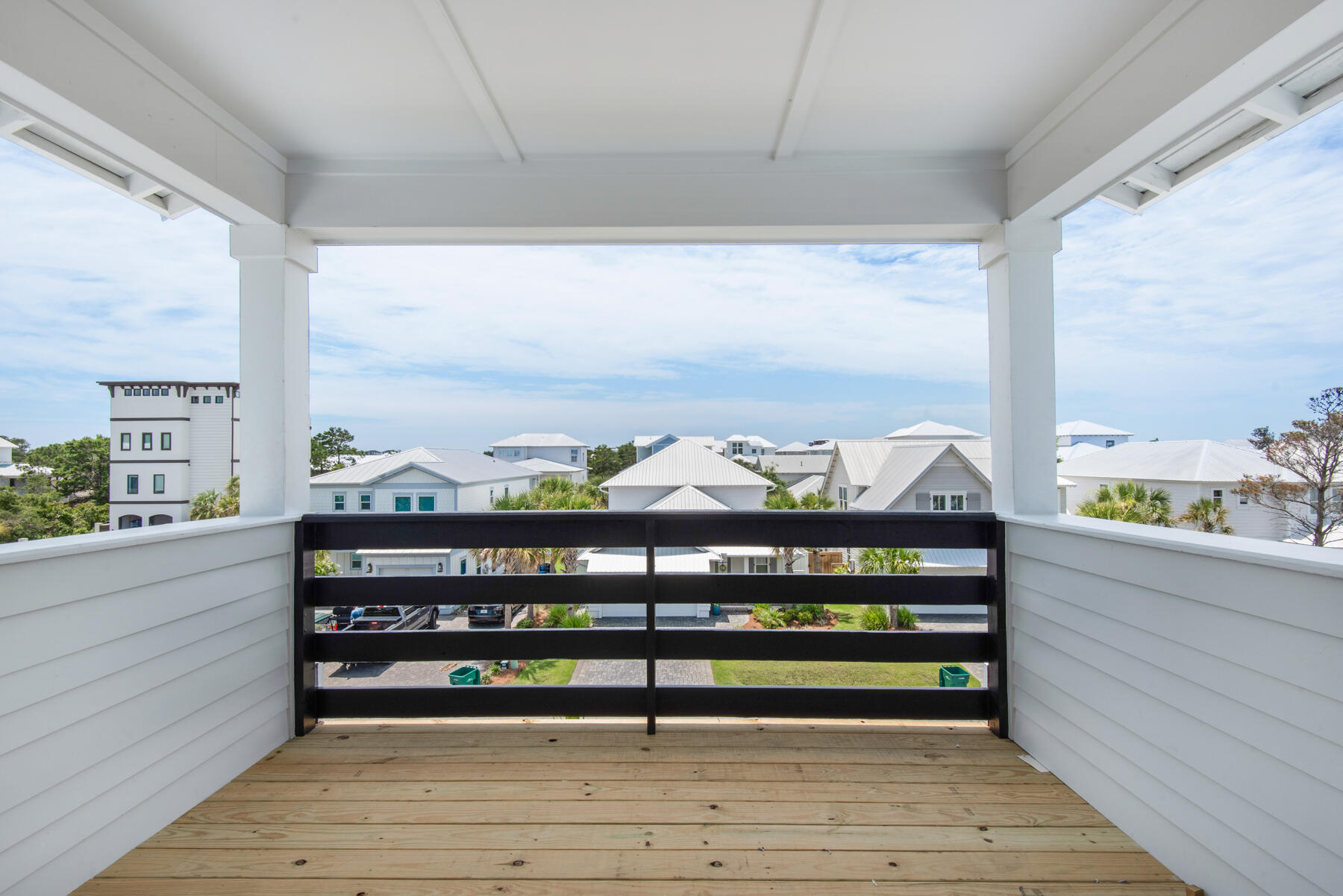 22 Ruth Street Miramar Beach, FL 32550 - Photo 62 of 66 a view of a balcony with two chairs and a table