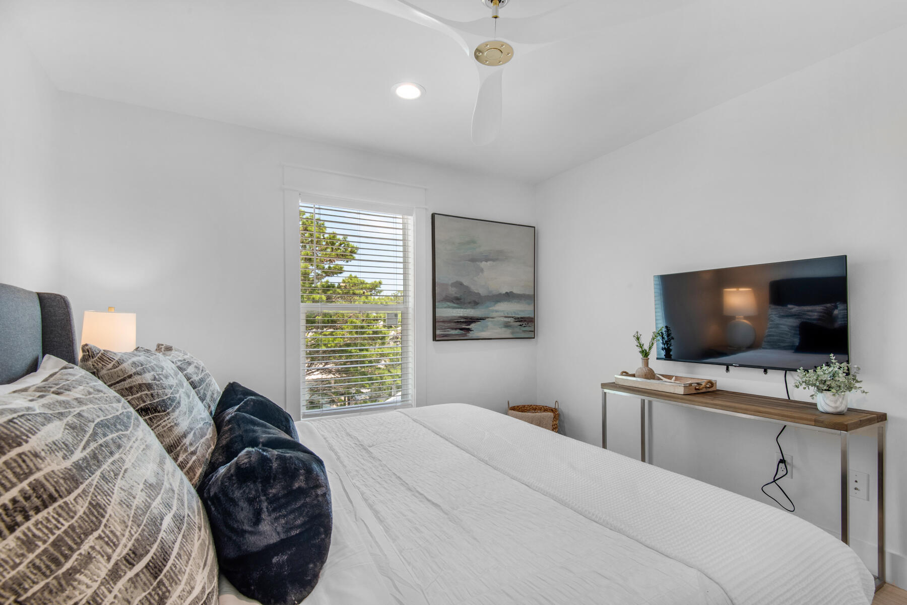 22 Ruth Street Miramar Beach, FL 32550 - Photo 64 of 66 a bedroom with a bed and a flat screen tv