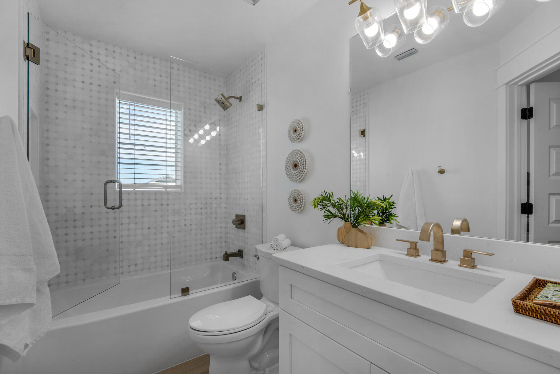 22 Ruth Street Miramar Beach, FL 32550 - Photo 66 of 66 a bathroom with a sink a toilet a mirror and shower