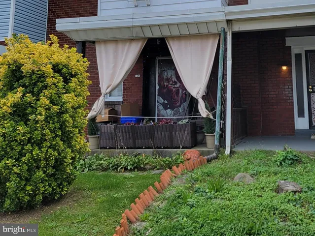 a view of a house with small yard