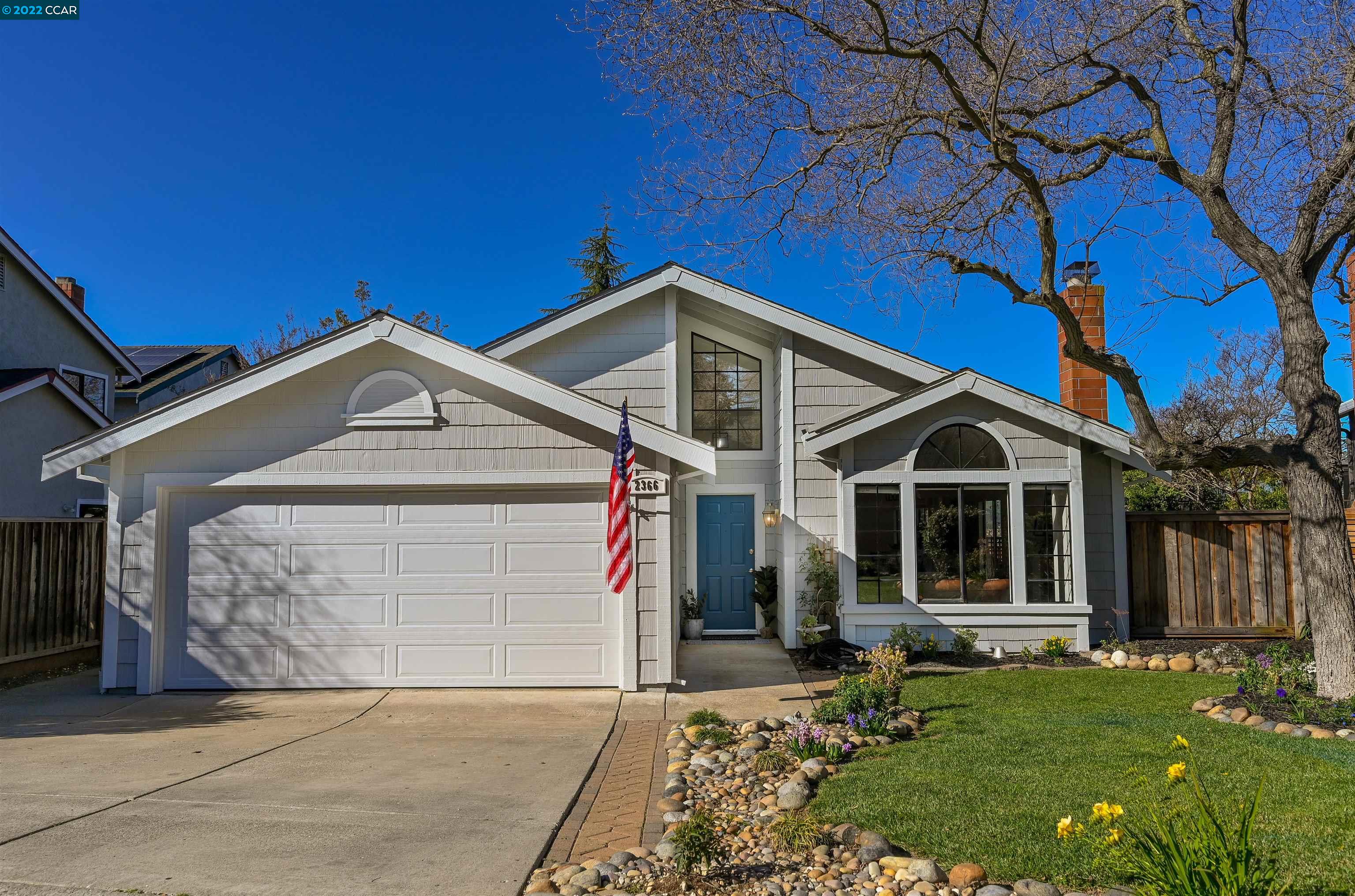 2366 Banbury Loop Martinez, CA 94553 - Photo 1 of 1 a front view of a house with a garden and yard