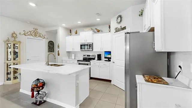 a kitchen with cabinets and appliances