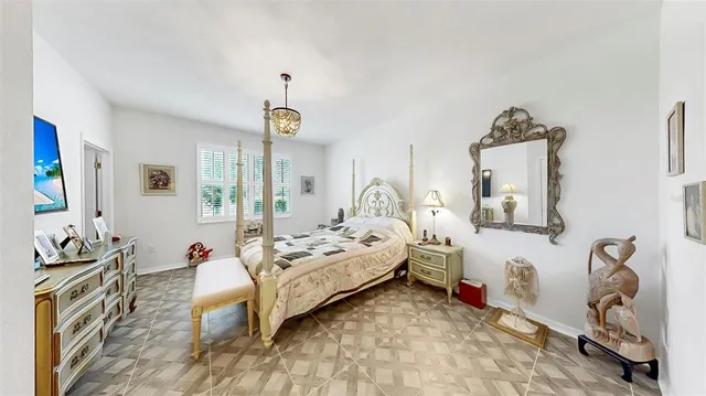 a bed room with a bed and a tv