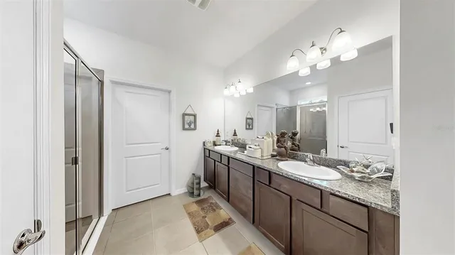 a bathroom with a glass shower door