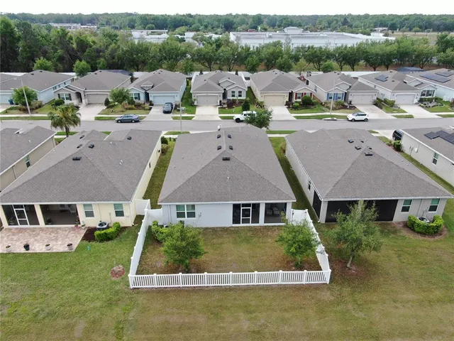 an aerial view of a house with a ocean view